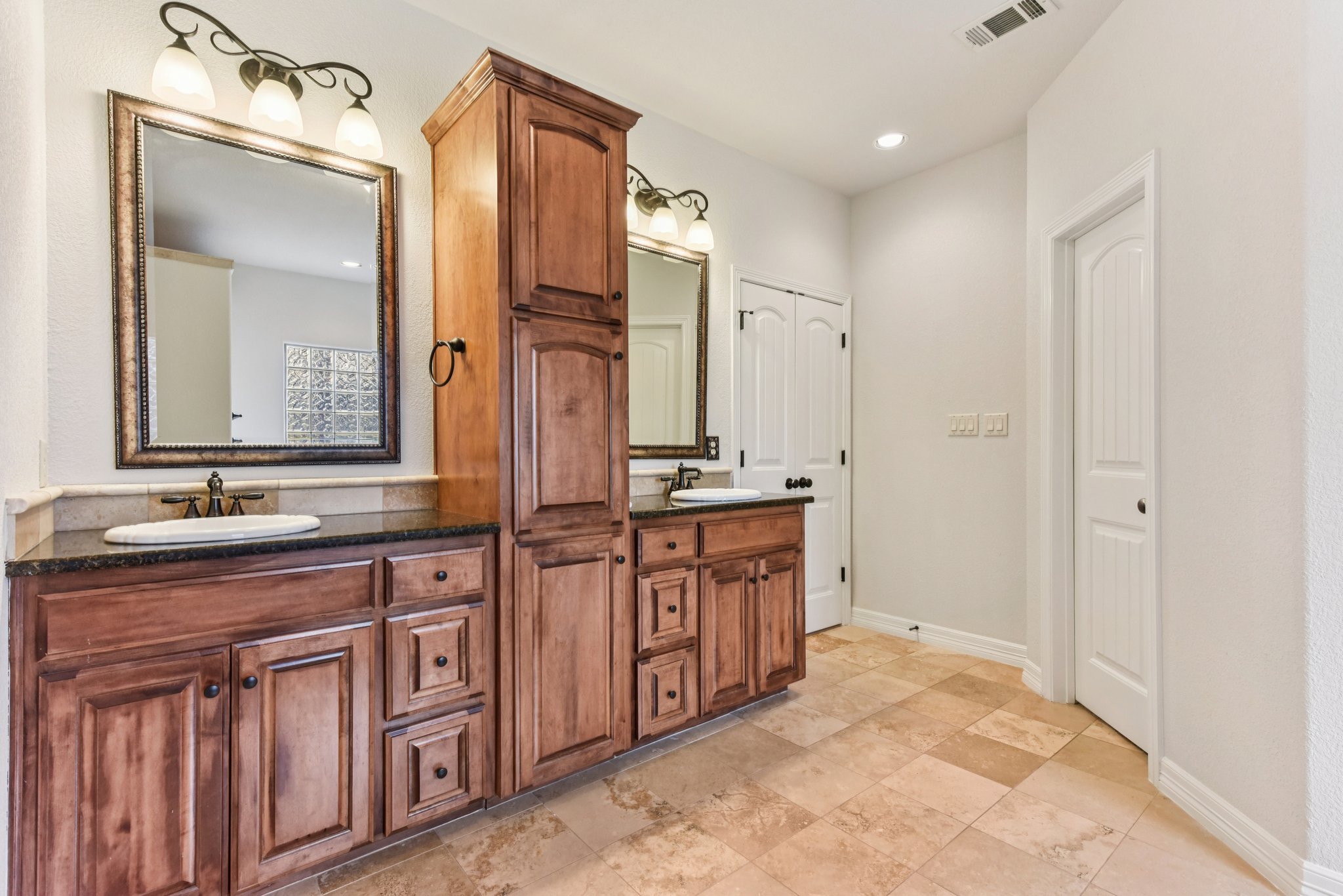 105 Silver Leaf Drive Georgetown, TX 78633 - Photo 15 of 40 a spacious bathroom with a granite countertop sink and a mirror