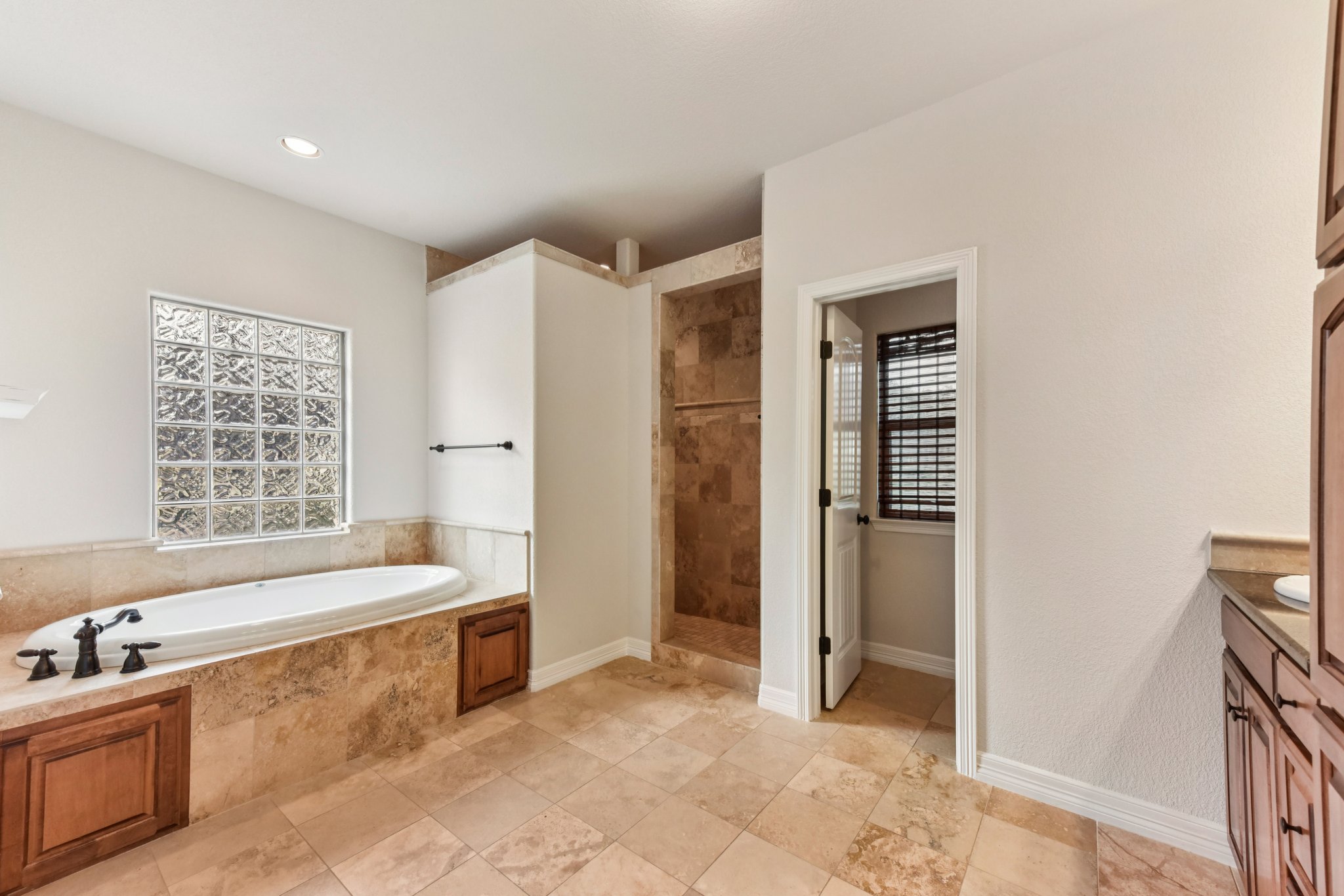 105 Silver Leaf Drive Georgetown, TX 78633 - Photo 16 of 40 a spacious bathroom with a tub sink and mirror