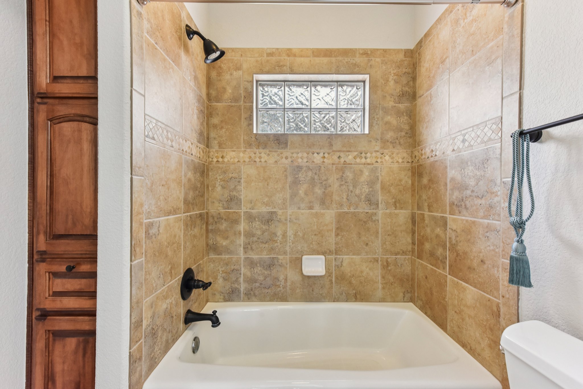 105 Silver Leaf Drive Georgetown, TX 78633 - Photo 23 of 40 a bathroom with a bathtub and shower