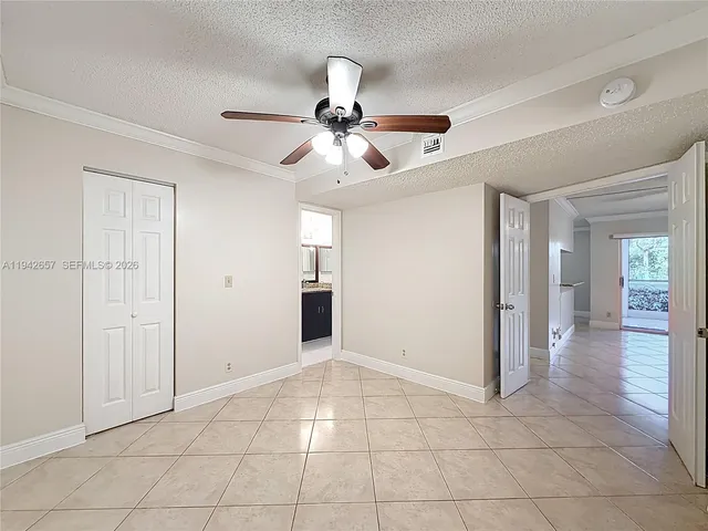 a bathroom with a granite countertop shower sink vanity mirror and toilet