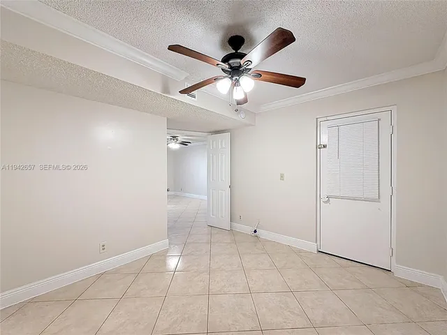 a en suite bathroom with a granite countertop sink and a mirror