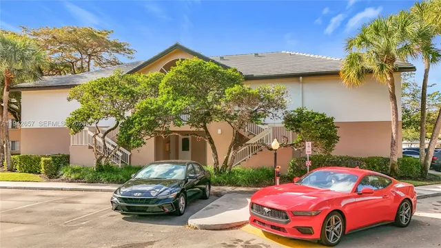 a front view of a house with parking space