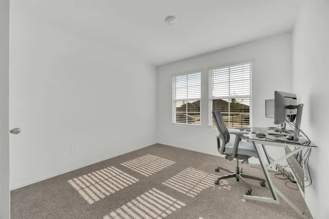 a workspace with furniture and a window