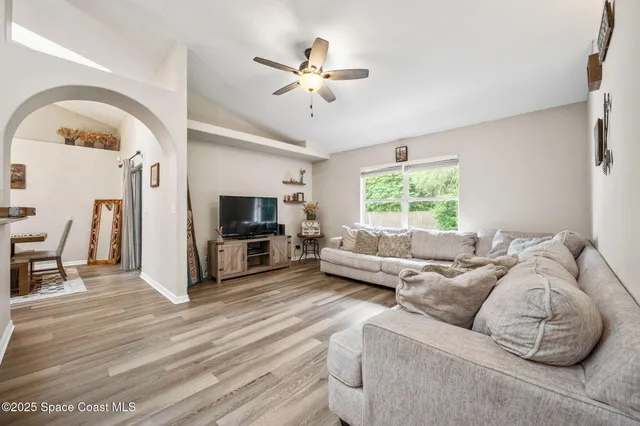 a living room with furniture fireplace and a flat screen tv