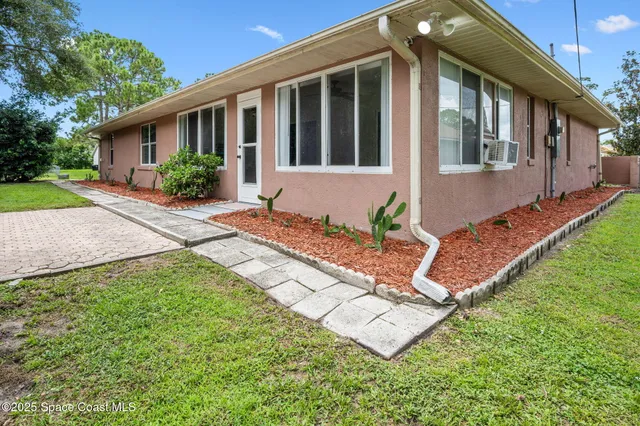 a view of a house with a garden