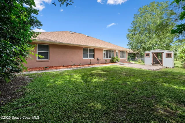 a view of a backyard with a garden