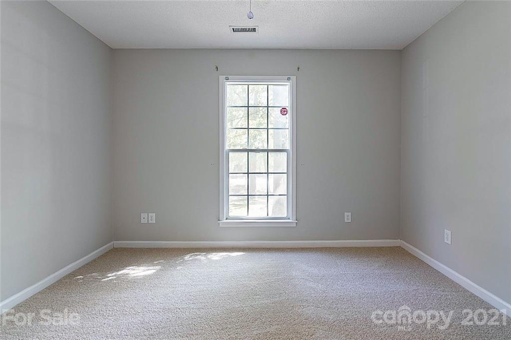 1323 Tucker Road Monroe, NC 28110 - Photo 11 of 17 an empty room with a window