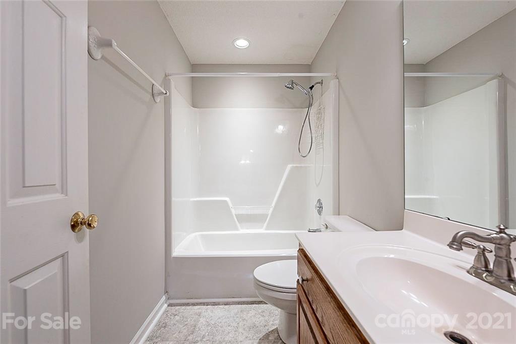 1323 Tucker Road Monroe, NC 28110 - Photo 14 of 17 a bathroom with a sink a toilet and shower