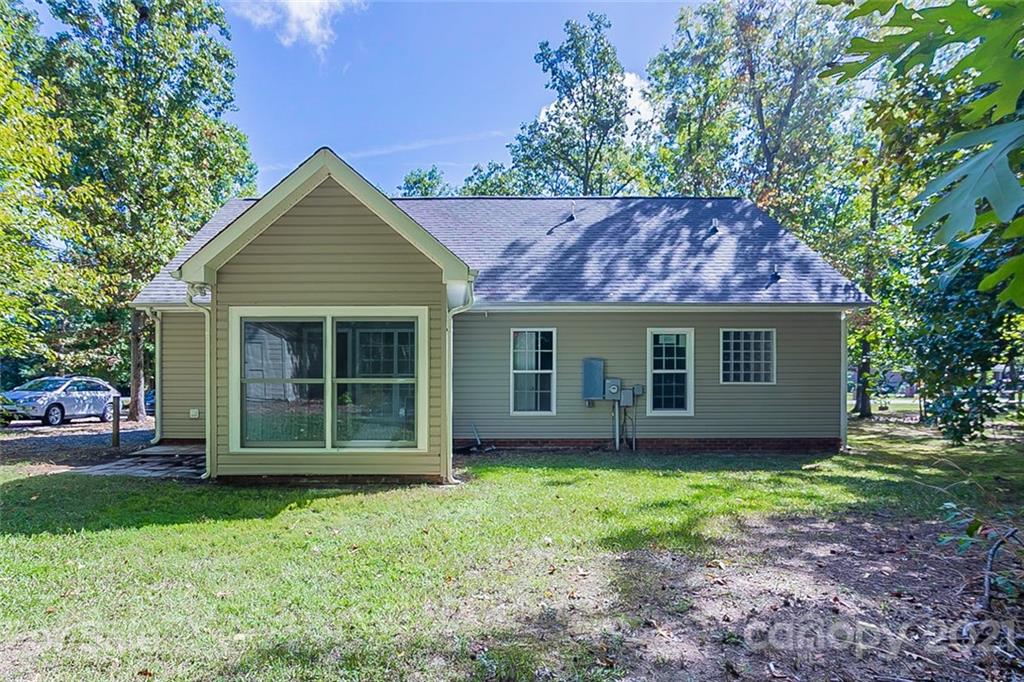 1323 Tucker Road Monroe, NC 28110 - Photo 16 of 17 a view of a house with yard and a garden