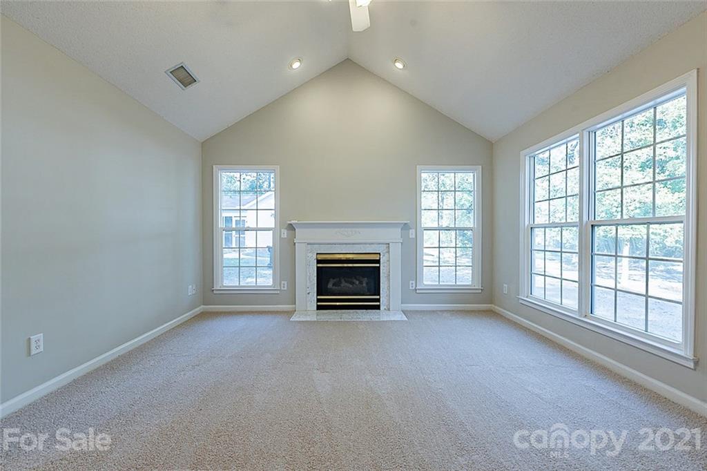 1323 Tucker Road Monroe, NC 28110 - Photo 3 of 17 a view of a livingroom with a fireplace and window