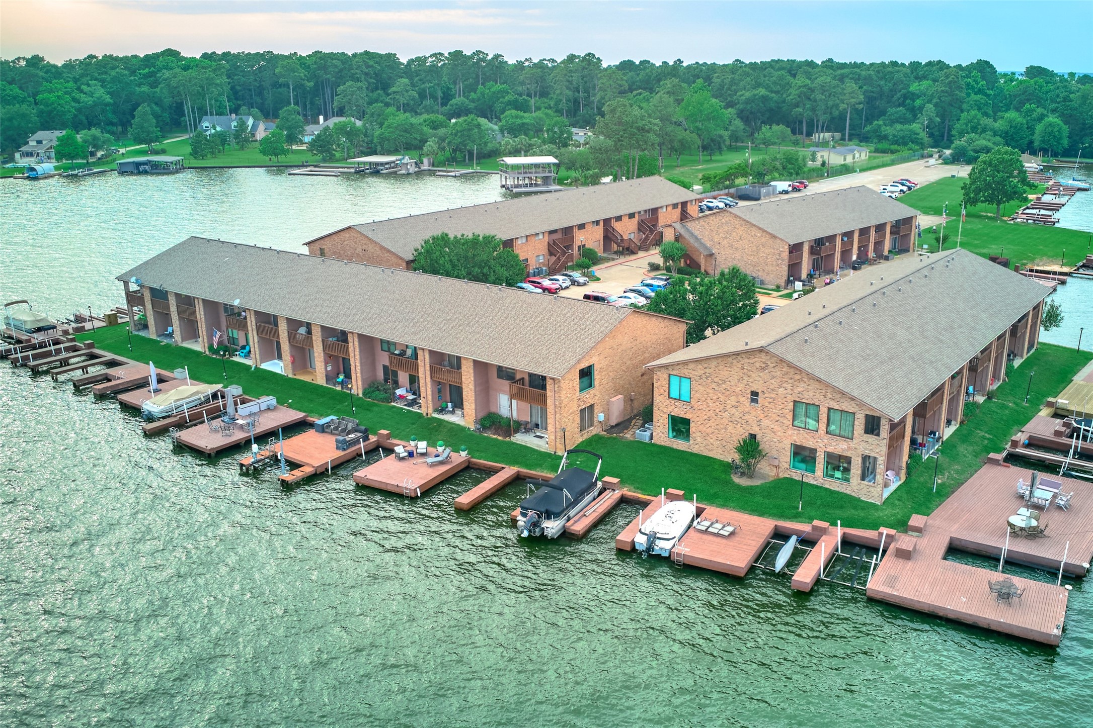 801 River Road, Unit E111 Montgomery, TX 77356 - Photo 18 of 24 an aerial view of a house with outdoor space lake view and large trees