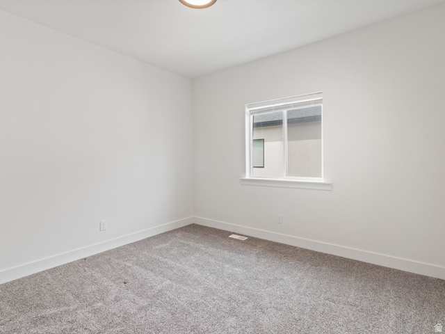 130 East 7085th South, Unit 3 Midvale, UT 84047 - Photo 20 of 30 Unfurnished room featuring carpet and baseboards