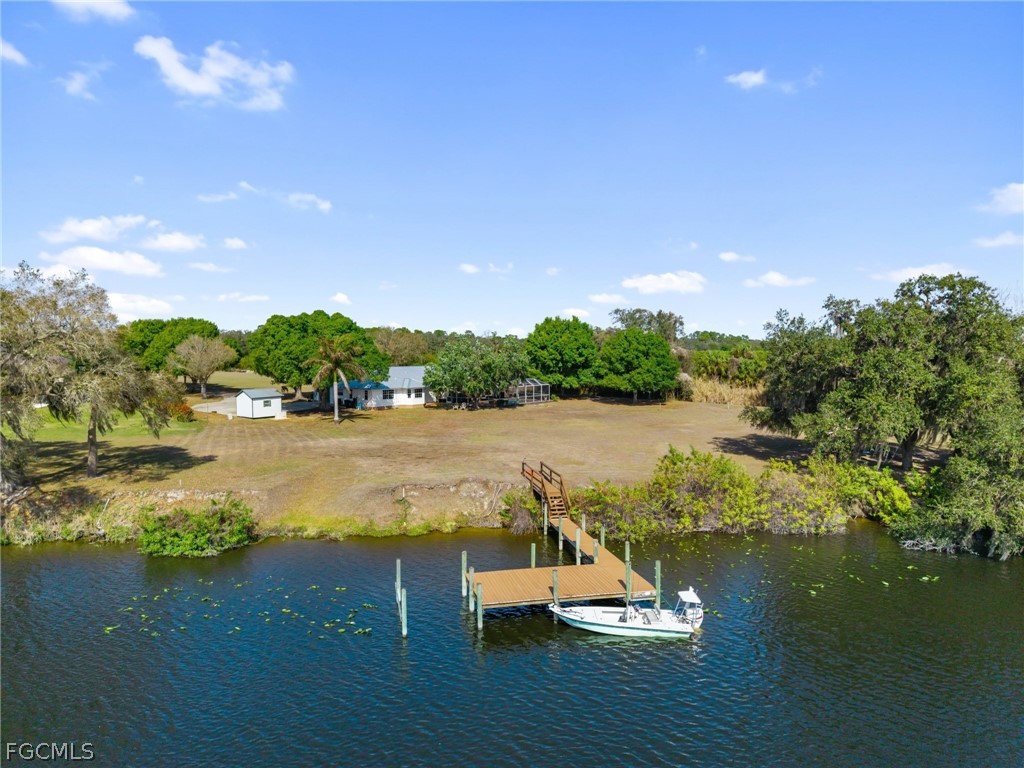 5997 Dragoon Court Fort Denaud, FL 33935 - Photo 1 of 49 a view of lake with green space