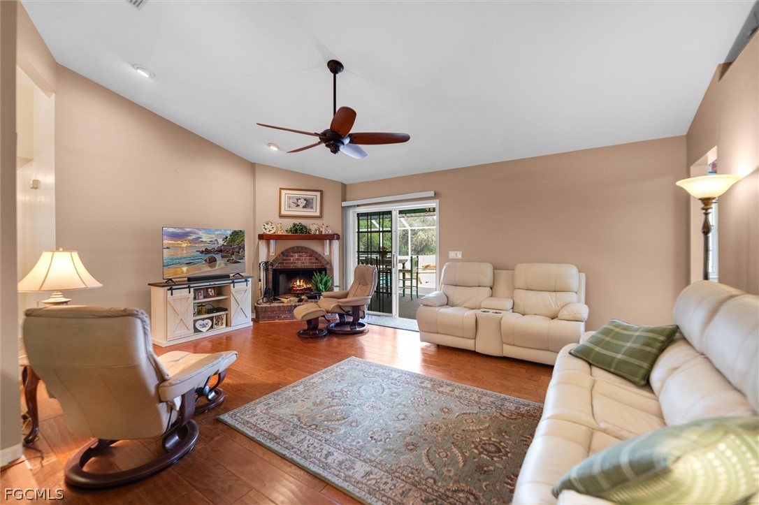 5997 Dragoon Court Fort Denaud, FL 33935 - Photo 14 of 49 a living room with furniture a window and a flat screen tv