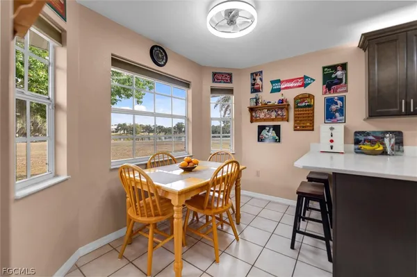 a dining room with furniture and window