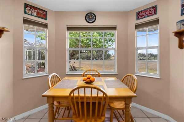 a view of a dining room with furniture window and outside view
