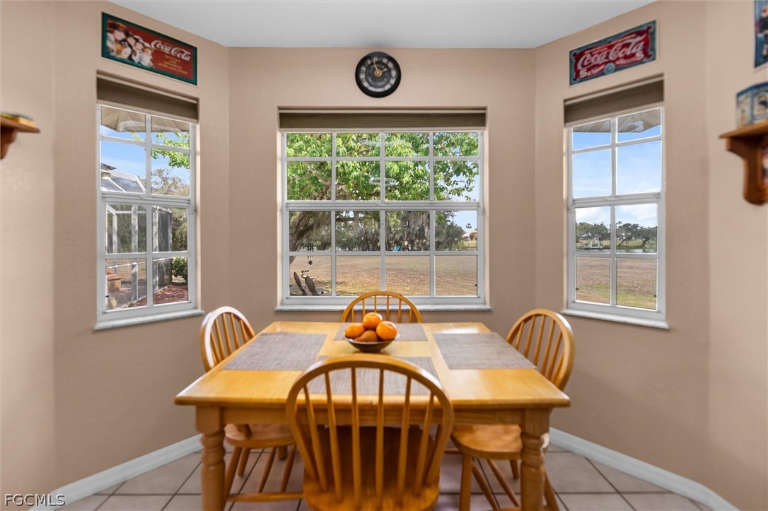 5997 Dragoon Court Fort Denaud, FL 33935 - Photo 17 of 49 a view of a dining room with furniture window and outside view