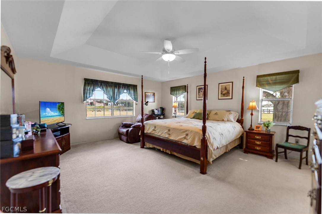 5997 Dragoon Court Fort Denaud, FL 33935 - Photo 21 of 49 a spacious bedroom with a bed and furniture