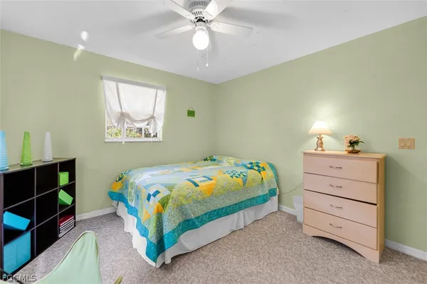 a bedroom with a bed and furniture