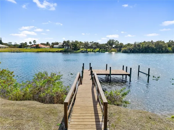 a view of a lake with houses in the back