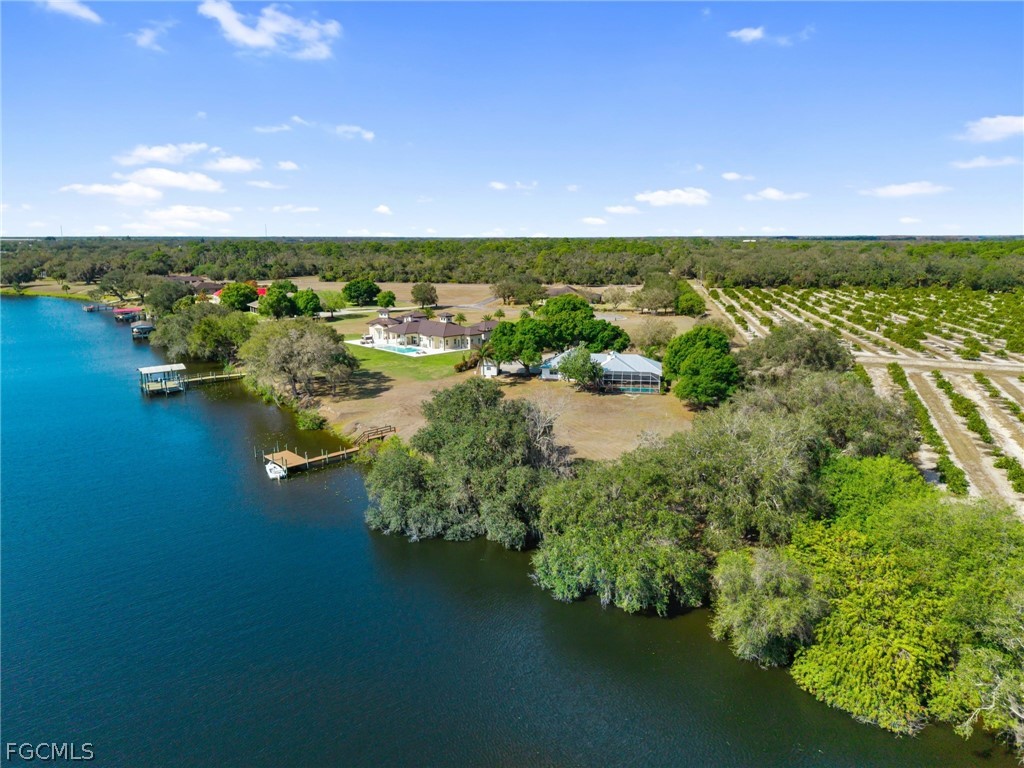 5997 Dragoon Court Fort Denaud, FL 33935 - Photo 37 of 49 a view of a lake with houses