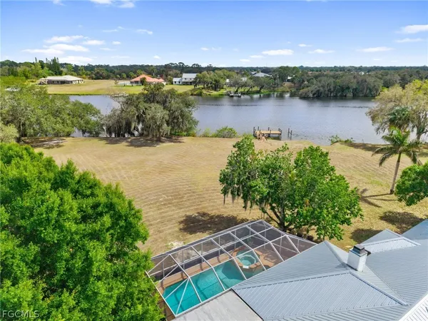 a view of a lake with outdoor seating