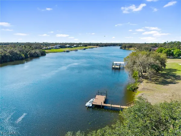 a view of a lake with houses in outdoor space