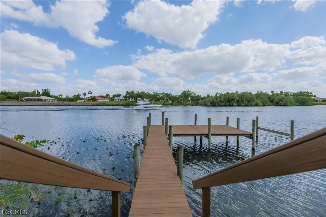 5997 Dragoon Court Fort Denaud, FL 33935 - Photo 48 of 49 a view of a lake with outdoor seating