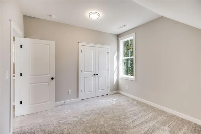 a view of a house with backyard