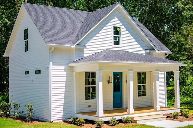 a view of a house with brick walls