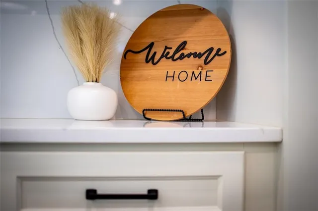 a kitchen with stainless steel appliances a stove microwave and sink