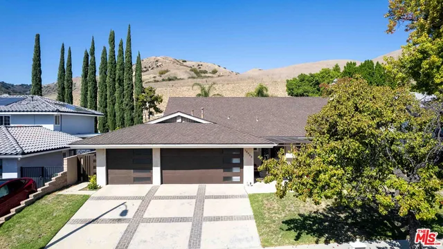 a view of a house with a garden