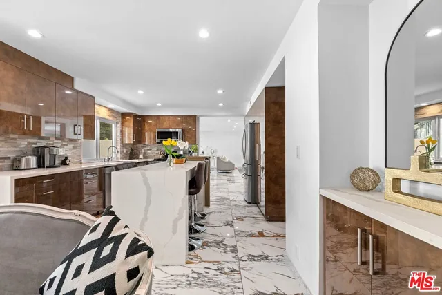 a bathroom with a double vanity sink mirror and shower