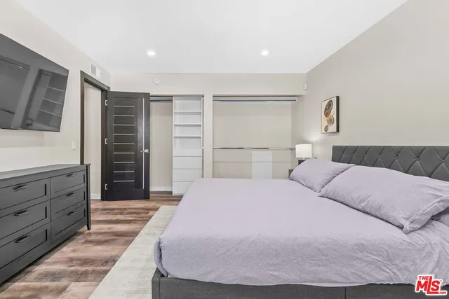 a living room with furniture and a dresser