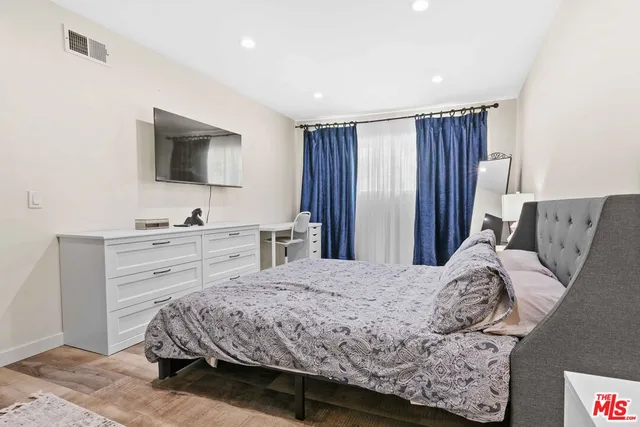 a view of swimming pool with outdoor seating and plants