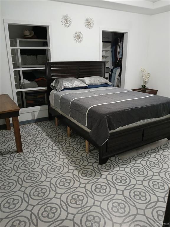 206 Commercial Street Edcouch, TX 78538 - Photo 14 of 16 a bedroom with a bed and a cabinets