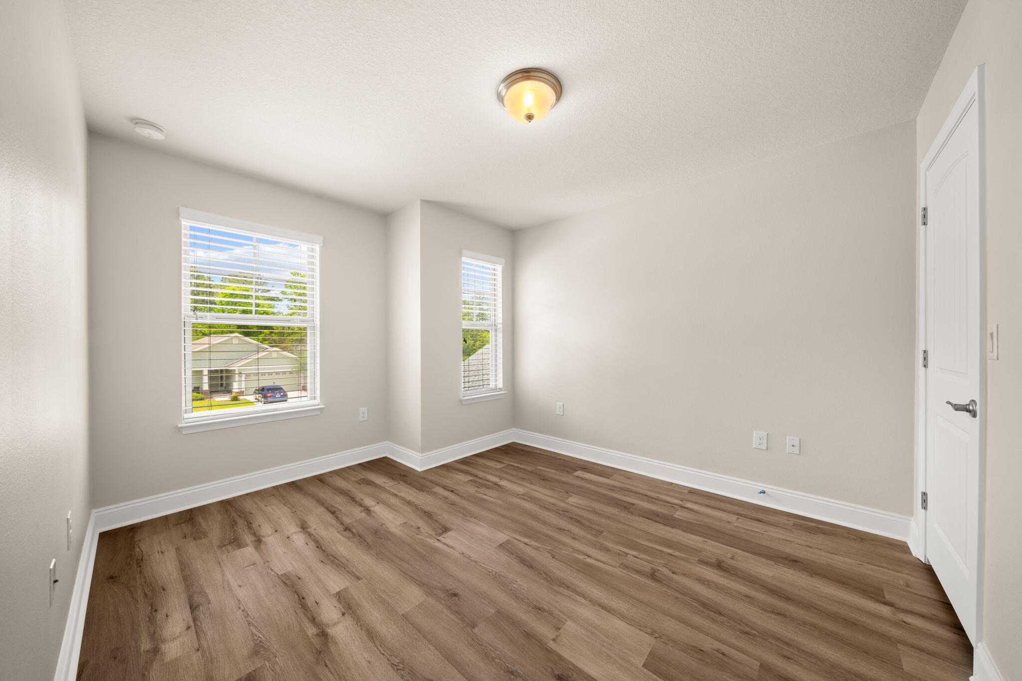 120 Brandywine Road Freeport, FL 32439 - Photo 17 of 55 wooden floor in an empty room with a window