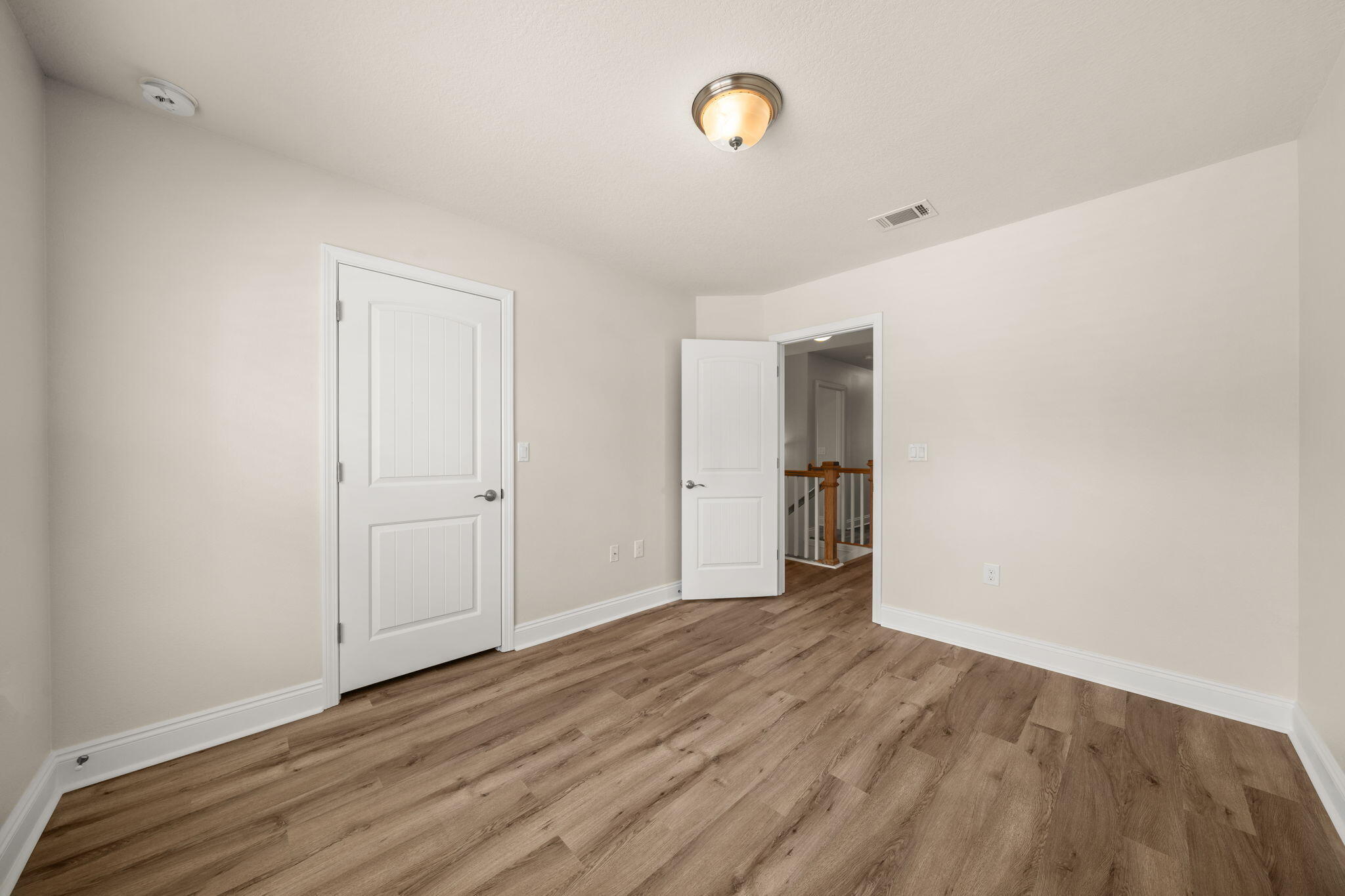 120 Brandywine Road Freeport, FL 32439 - Photo 20 of 55 a view of an empty room with wooden floor and a window