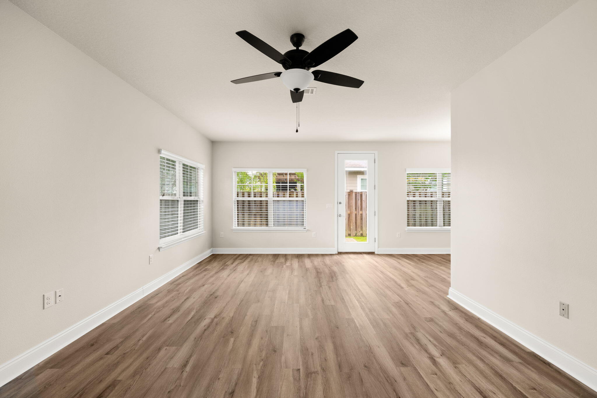 120 Brandywine Road Freeport, FL 32439 - Photo 7 of 55 a view of empty room with wooden floor and fan
