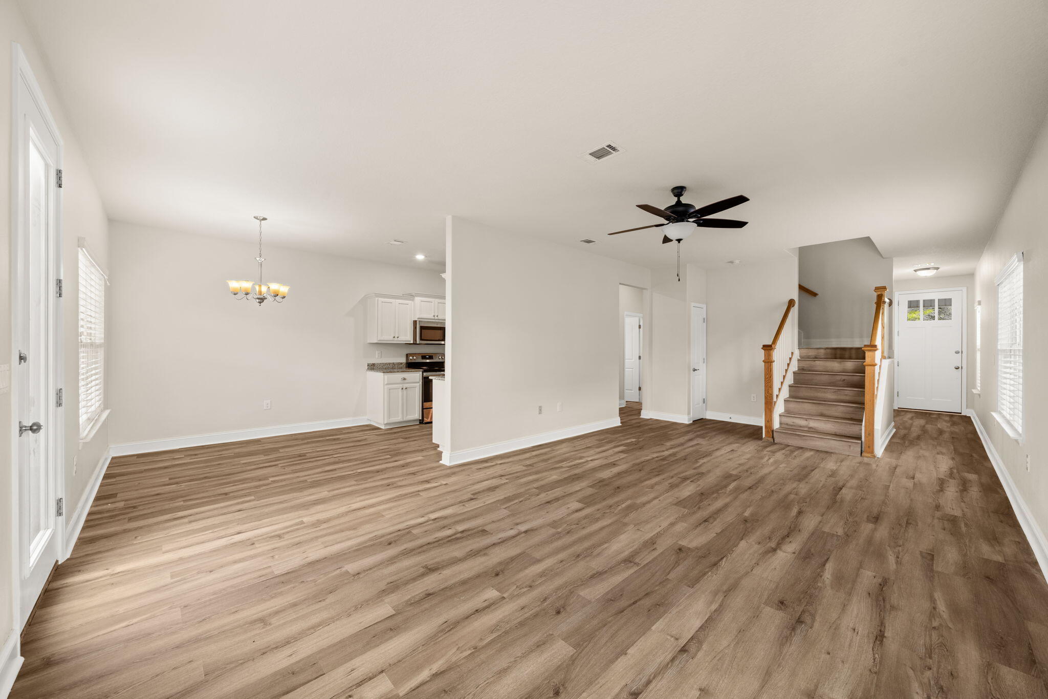 120 Brandywine Road Freeport, FL 32439 - Photo 8 of 55 a view of empty room with wooden floor and window