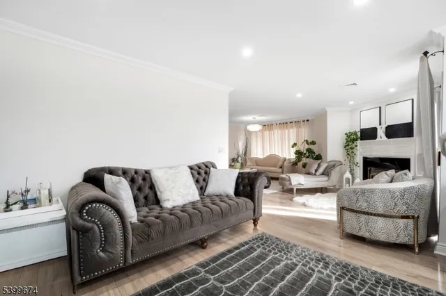 a living room with furniture fireplace and window