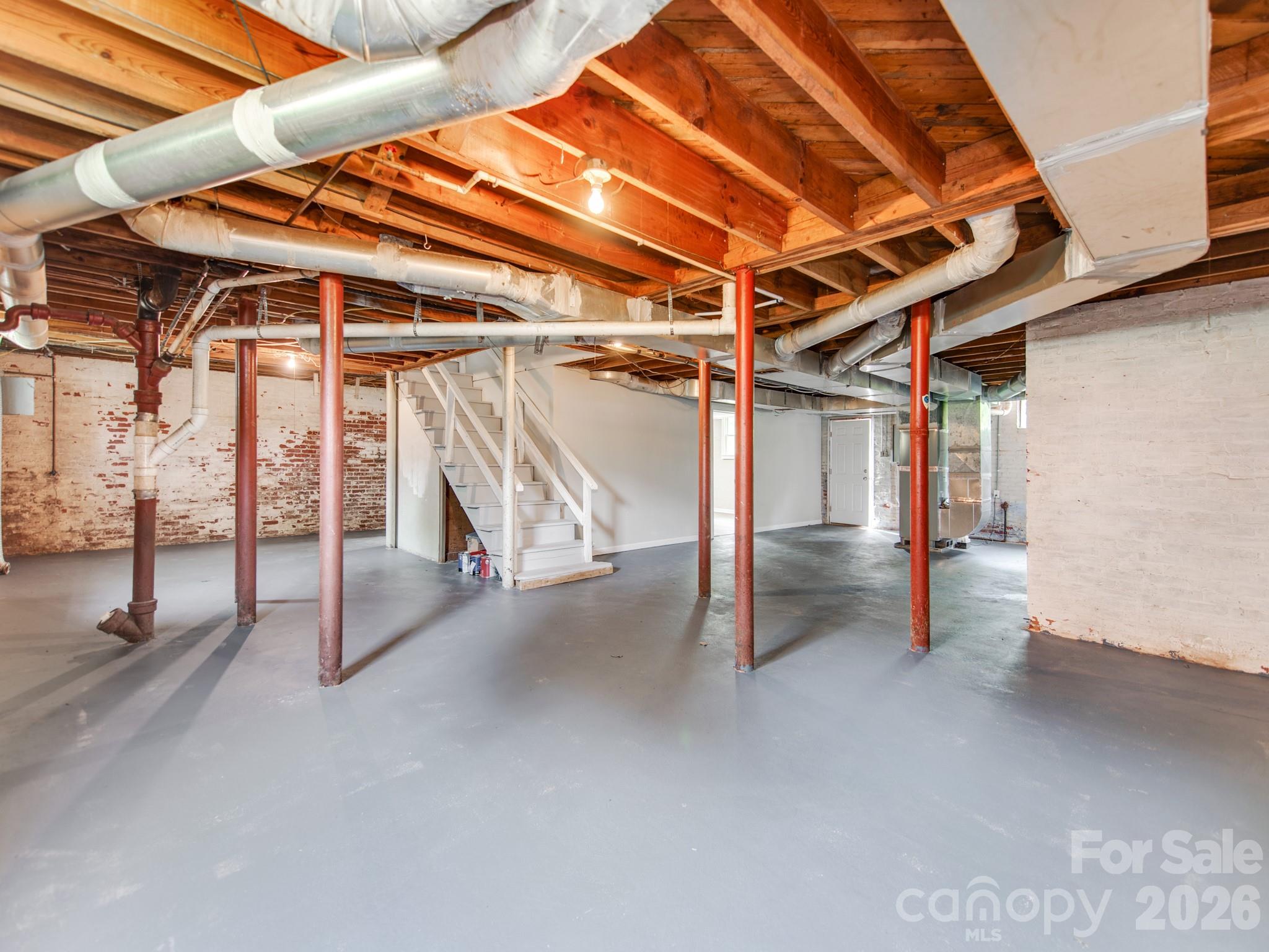 113 Falls Street Morganton, NC 28655 - Photo 23 of 33 a view of an empty room with wooden floor
