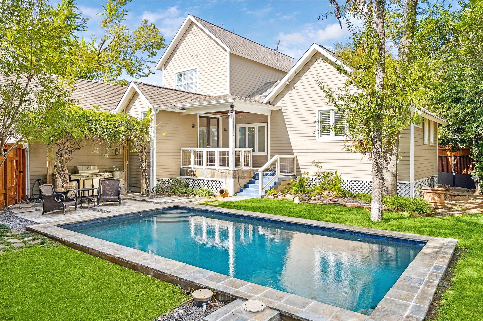 1238 West 22nd Street Houston, TX 77008 - Photo 1 of 43 Huge pool. Outdoor grill with beautiful Wisteria growing over the trellis. The colors in spring really pop. Home is 2,721 sqft on a 9,486 sqft lot. The whole house has double-pane windows and the exterior is a mix of stone and cement board.
