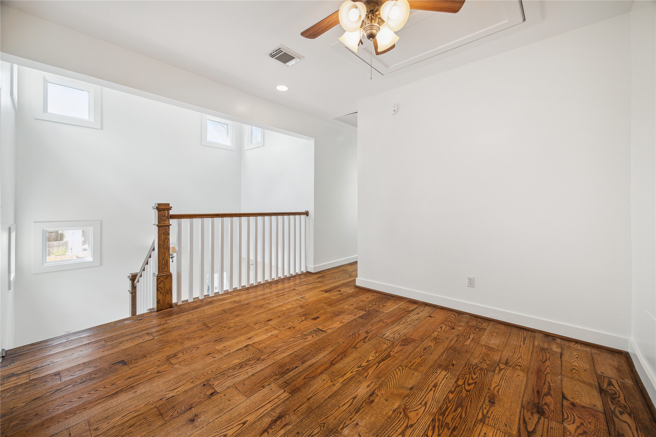 1238 West 22nd Street Houston, TX 77008 - Photo 21 of 43 Let's head upstairs! At the top of the stairs there is a flex space (17x12) for a gym, playroom, second office, den, and so much more. The space sits in between the 2 upstairs bedrooms providing a buffer space.