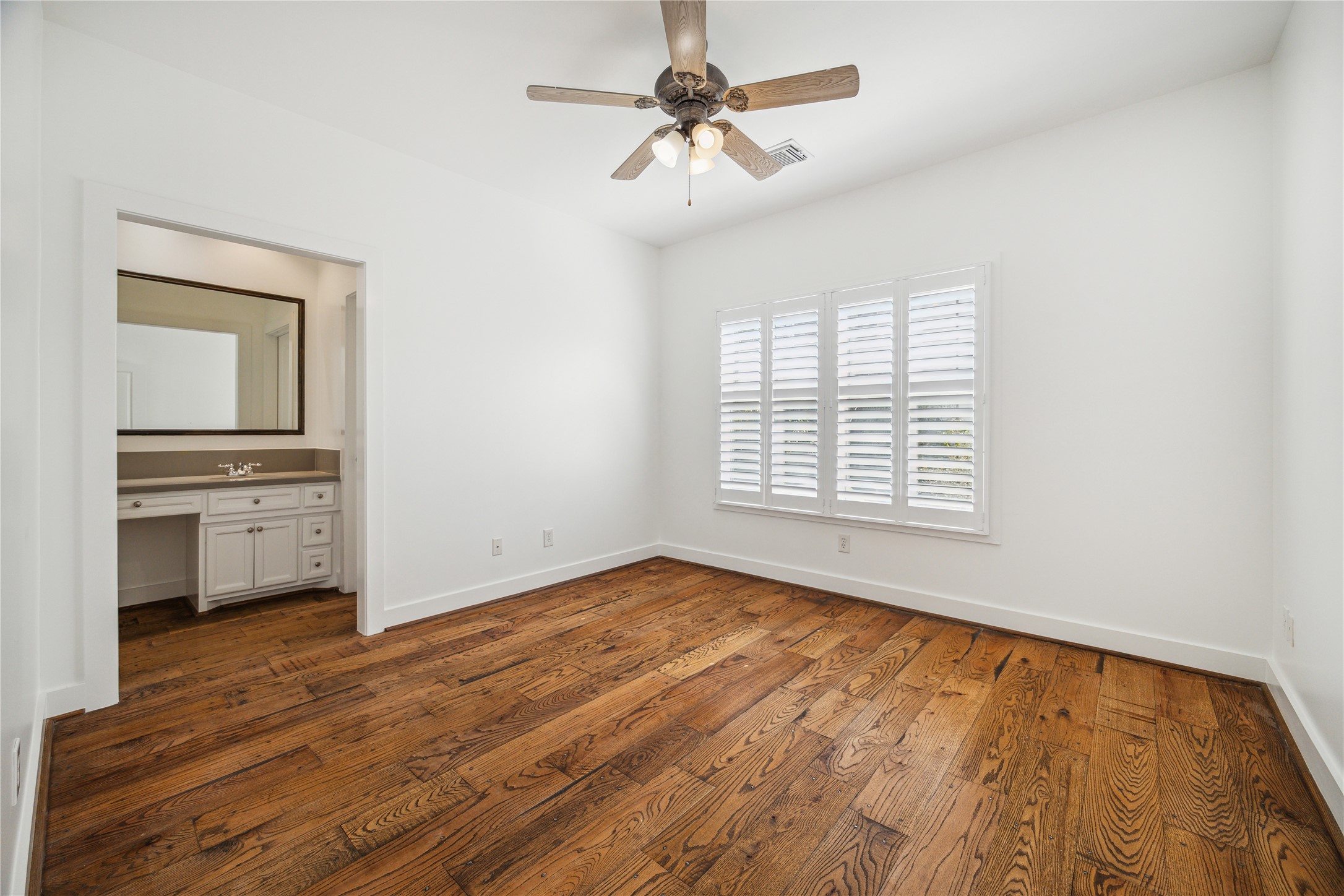 1238 West 22nd Street Houston, TX 77008 - Photo 22 of 43 Upstairs 2nd bedroom (13x12) has plantation shutters with views of the backyard and private ensuite bathroom with walk-in closet (7x6).
Both upstairs bedrooms, bathrooms, and closets are the exact same size, which is so great for families or roommates.
