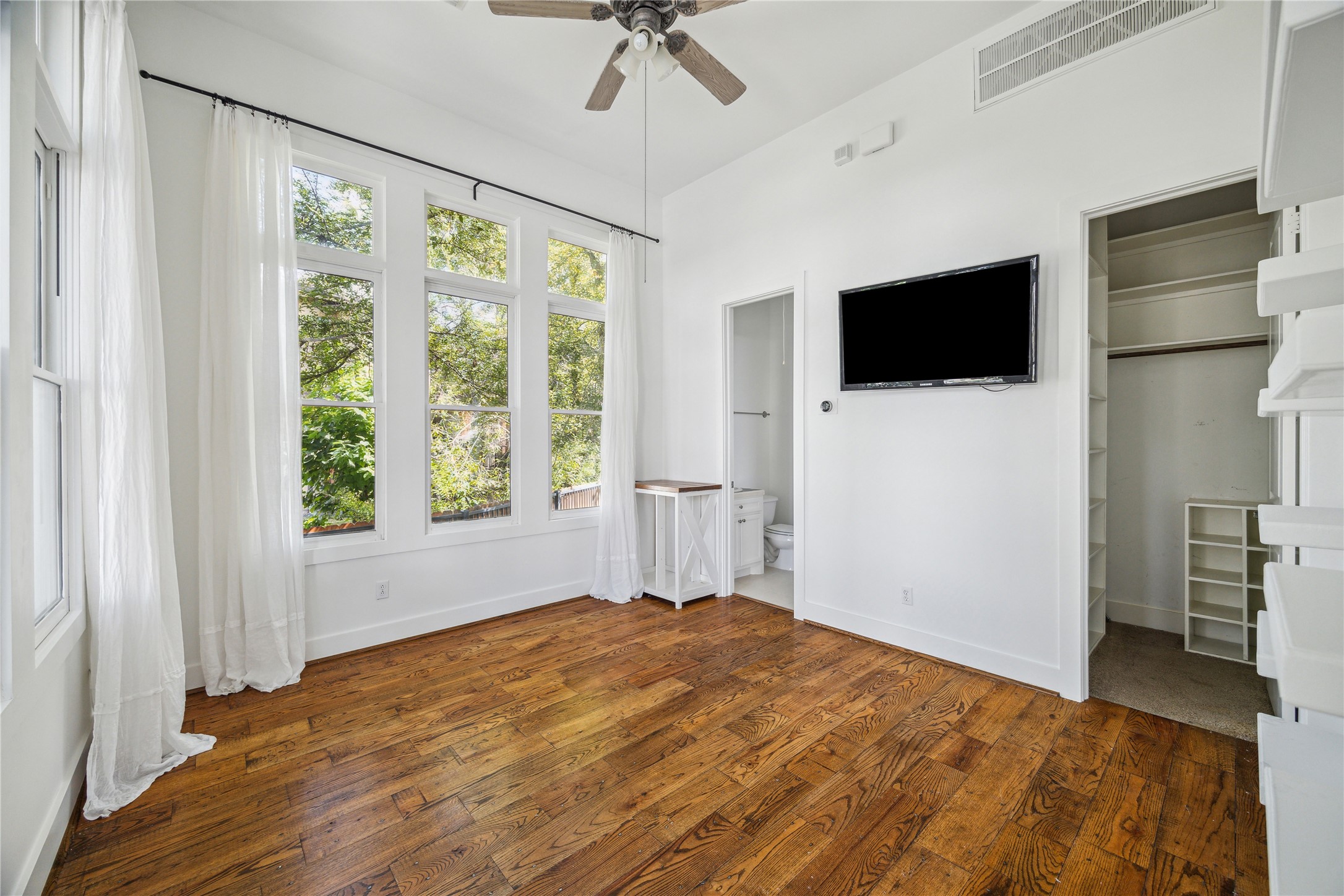 1238 West 22nd Street Houston, TX 77008 - Photo 31 of 43 The room features high ceilings and the TV and drapes are included in the sale