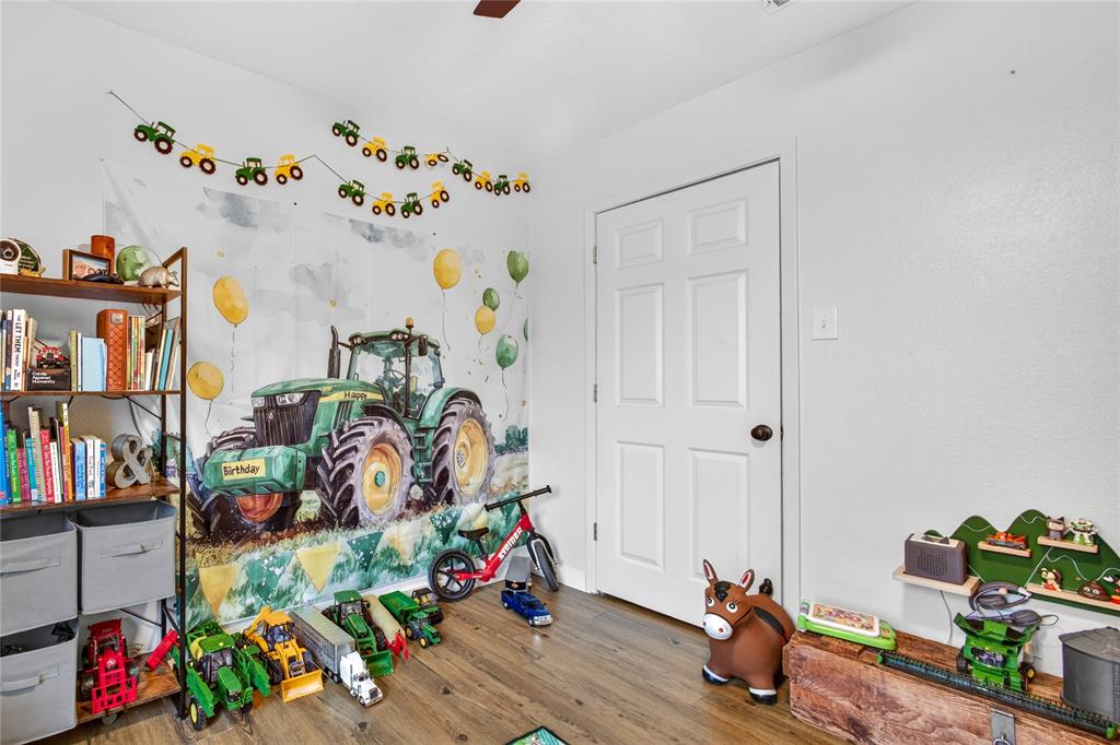 703 College Street Celeste, TX 75423 - Photo 22 of 29 a view of a room with toys and wooden floor