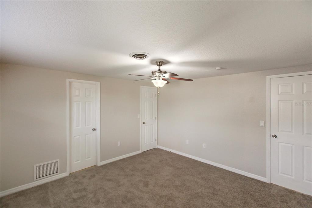 1107 Seneca Road Venice, FL 34293 - Photo 16 of 30 a view of a chandelier fan in a room