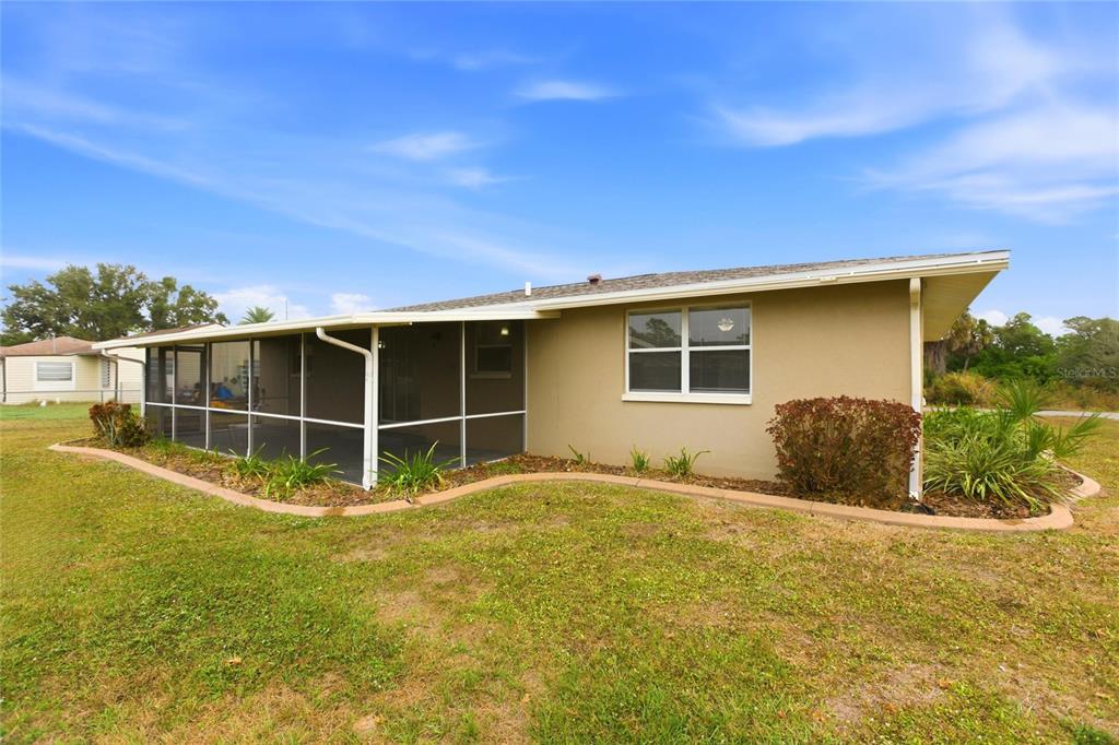 1107 Seneca Road Venice, FL 34293 - Photo 28 of 30 a view of an house with backyard space and balcony