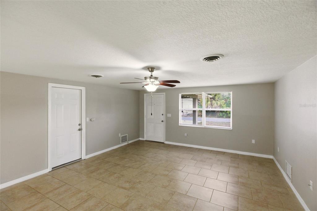 1107 Seneca Road Venice, FL 34293 - Photo 6 of 30 a view of an empty room with a window